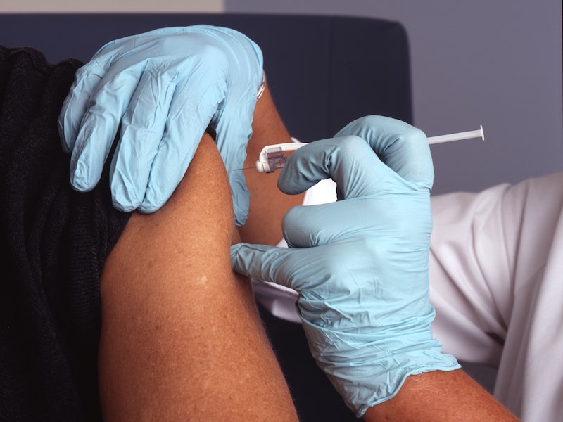 Person getting a vaccine shot in the arm